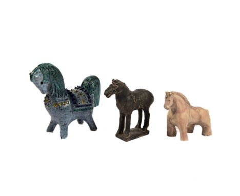 Three captivating horses make up this collection. The first is a Chinese warrior horse finished in black matte, followed by a