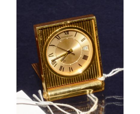 A Jaeger Le Coultre pocket desk/travel timepiece, with champagne circular dial, black Roman numerals and date aperture, in en