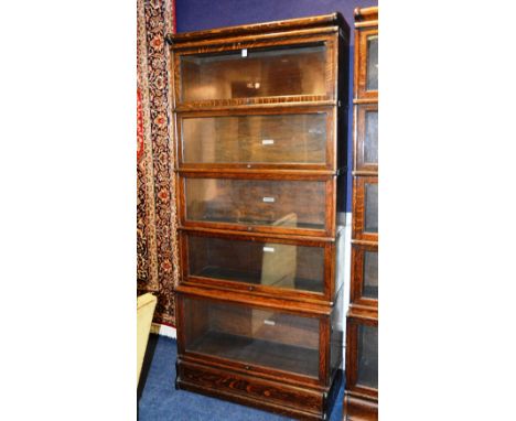 A Globe Wernicke oak stacking bookcase, with five sections and glazed doors, 192cm high x 86cm wide x 31cm deep