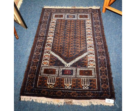 A prayer mat, with arrow head design, mihrab over brown ground and dog tooth and rosette border, 138 x 88cm