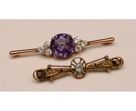 A 14ct gold amethyst and paste set brooch, together with an 18ct gold aquamarine and seed pearl brooch (2)