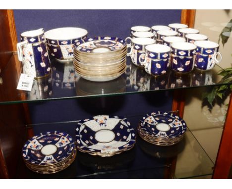 An Imari pattern china tea set comprising of two biscuit plates, cream and sugar, 12 side plates, 12 saucers and 12 cups (40)