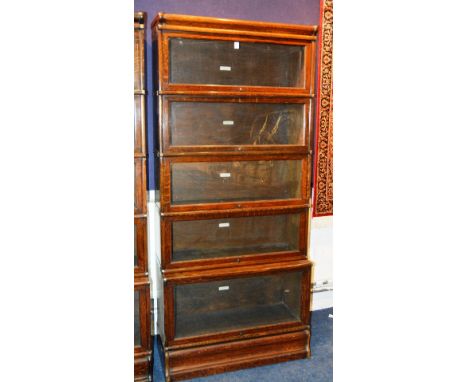 A Globe Wernicke oak stacking bookcase, with five section and glazed doors, 192cm high x 86cm wide x 31cm deep