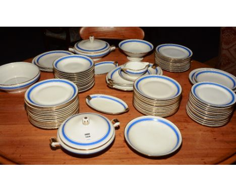 A ceramic dinner set comprising of two platters, four tureens, two serving bowls, gravy boat, two stands, dinner plate, 37 si
