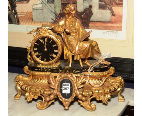 A late 19th early 20th century Continental gilt metal and marble figural mantel clock, with classical female figure sitting r