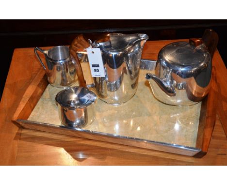 A Piquot ware five piece tea service comprising teapot, water jug, sugar and cream, on tray (5)
