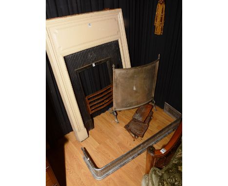 A cast iron fire surround, with panelled frieze, moulded frame and fluted insert Reg No. 556523, including screen and fender,