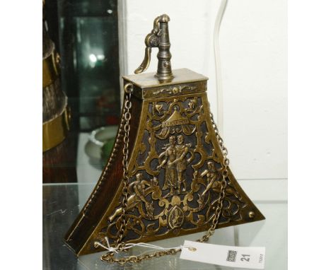 A Classical style brass powder flask, with embossed decoration and hanging chain, 21cm high