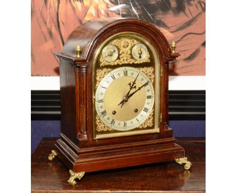 A 20th century George III style mahogany bracket clock, with domed top, gilded dial, silvered chapter ring and two subsidiary