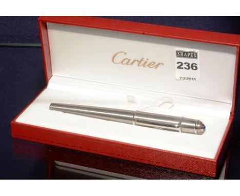 A Must de Cartier silvered pen, in a fitted red leather tooled case, 14cm long CONDITION REPORT: Lot 236 - The pen is stamped