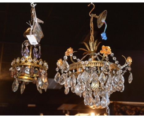 Two decorative cut glass ceiling lights, both with pear shaped drops surrounded by small hexagonal drops, one having amethyst