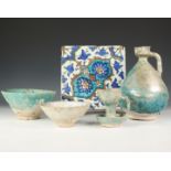 Iran, two Kashan, turquoise-glazed bowls and two flasks, ca. 13th century and Turkey, a Kutahya tile