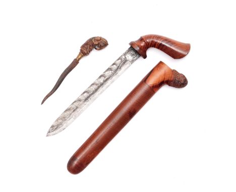 Java, dagger, badek and Bali, a small kris with horn hilt. badek with pistol hilt and sheath made of flaming wood, the blade 