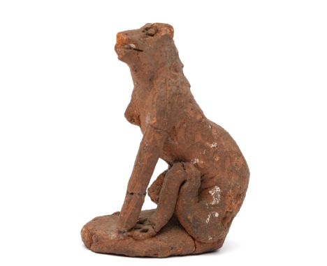 A terracotta sculpture of a seated dog, possibly Middle Ages. h. 6,2 cm. Provenance: Collection Carl Gumpert (1878-1955) an A