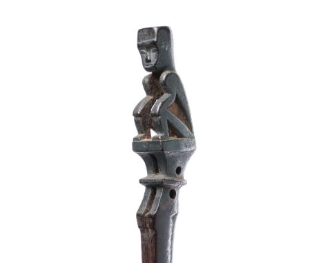 Sumatra, Batak, a lute, hasapi, 19th century; boat shaped sound box, one end surmounted by a crouching figure. With blackened
