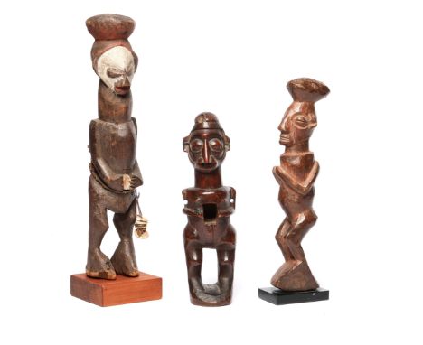 D.R. Congo, Yaka, power figure and two Yaka figures; the first item, phuongu, with blackish brown patina and traces of resin.
