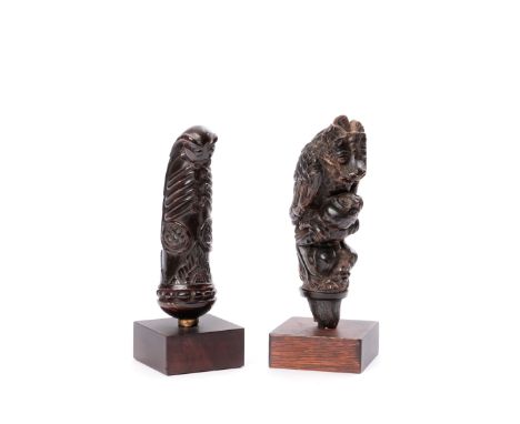 Bali - Lombok, two horn kris hilts, one depicting a mythical animal perched on the shoulderf of a man,the other an insect. H.