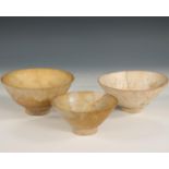 Persia, three undecorated off white glazed bowls, 14-16th century,