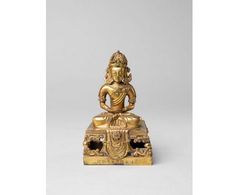 A CHINESE GILT-BRONZE FIGURE OF AMITAYUSNINE-CHARACTER QIANLONG MARK AND OF THE PERIOD, DATED 1770Seated in dhyanasana on a r