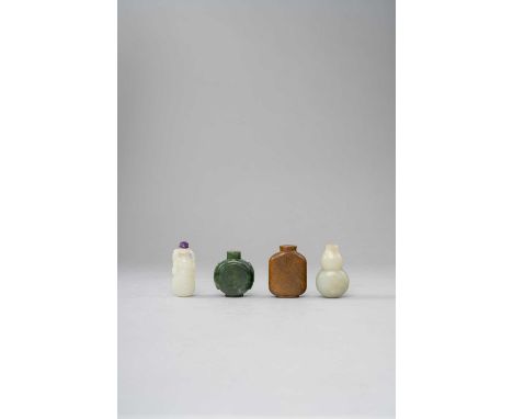 FOUR CHINESE JADE SNUFF BOTTLESQING DYNASTYTwo celadon jade carved as a gourds; another spinach green jade of panelled circul