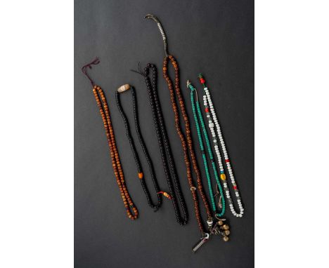 SIX CHINESE BEAD NECKLACES19TH/20TH CENTURYVariously composed of zitan, hardwood, coloured beads and metal ornaments, 55cm ma