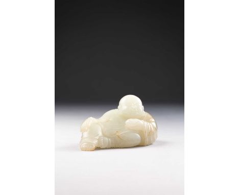 A CHINESE PALE CELADON JADE CARVING OF A MONKQING DYNASTY OR LATERThe reclining figure holding a bowl in his left hand, dress