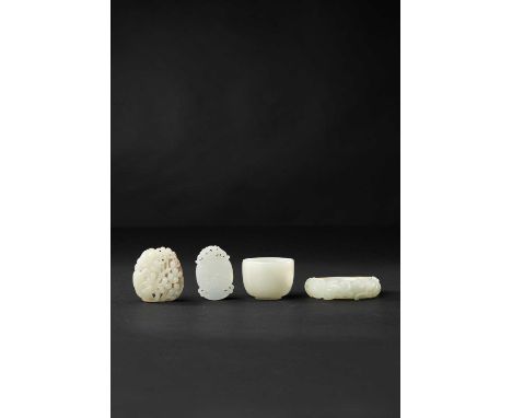 FOUR CHINESE PALE CELADON AND WHITE JADE CARVINGSQING DYNASTYComprising: a bangle carved with three striding chilong and a my