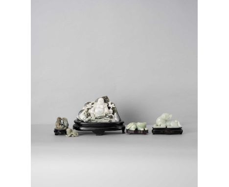 FIVE CHINESE JADE AND HARDSTONE CARVINGSQING DYNASTY AND LATERComprising: a celadon jade Buddhist lion group; three recumbent