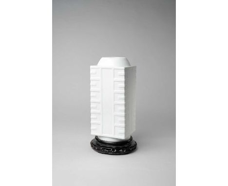 A LARGE CHINESE WHITE-GLAZED CONG-SHAPED VASE 18TH CENTURYThe square-section body moulded in relief with a geometric design t
