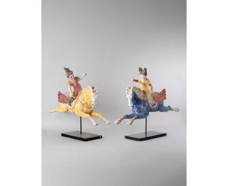 A PAIR OF CHINESE POTTERY FIGURES OF FEMALE POLO PLAYERS TANG DYNASTY OR LATER  Depicting two equestrians lunging to one side