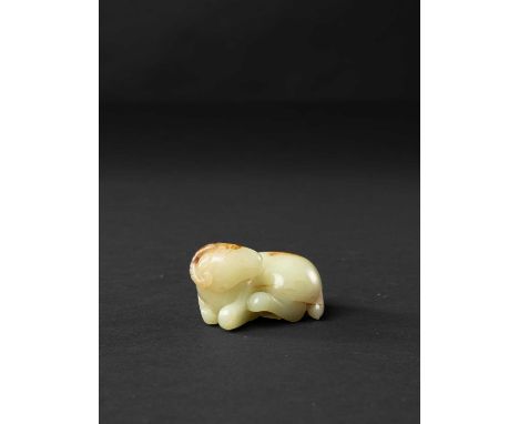 A CHINESE YELLOW JADE CARVING OF A RAMLATE QING DYNASTY The recumbent ram with his head turned to sinister and his legs folde