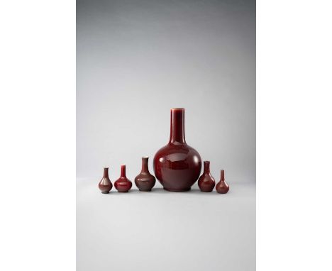 SIX CHINESE COPPER-RED BOTTLE VASESQING DYNASTY AND 20TH CENTURYTwo with Kangxi marks, the largest 20th century with a six-ch