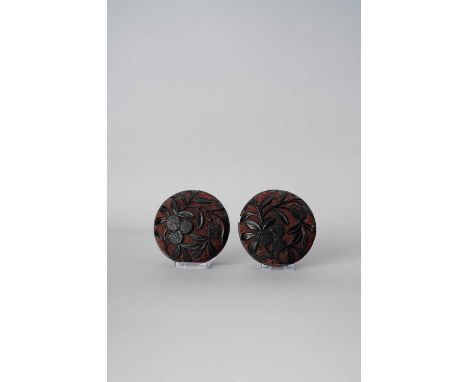 A PAIR OF CHINESE CINNABAR AND BLACK LACQUER 'LYCHEE' BOXES AND COVERS MING DYNASTY OR LATER  The domed circular bodies carve