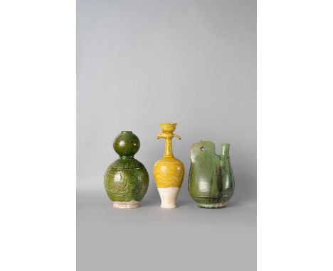 THREE CHINESE GLAZED POTTERY VESSELSPROBABLY TANG OR LIAO DYNASTYComprising: a green-glazed flask with a single lug handle, a