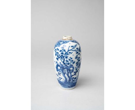 A CHINESE BLUE AND WHITE OVOID VASEKANGXI 1662-1722Painted with panels of prunus and rockwork, 22cm.