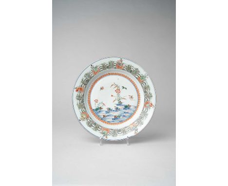 A CHINESE FAMILLE VERTE 'MANDARIN DUCK AND EIGHT IMMORTALS' DISHKANGXI 1662-1722Painted and gilded to the centre with mandari