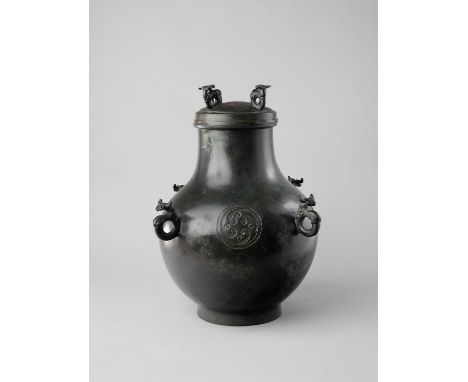 A LARGE CHINESE BRONZE ARCHAISTIC RITUAL WINE VESSEL AND COVER, HUPROBABLY QING DYNASTYIn Han dynasty-style, the bulbous body