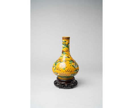 A CHINESE YELLOW-GROUND 'DRAGON' BOTTLE VASE LATE 19TH CENTURYIncised with three scaly dragons chasing pearls, a six-characte