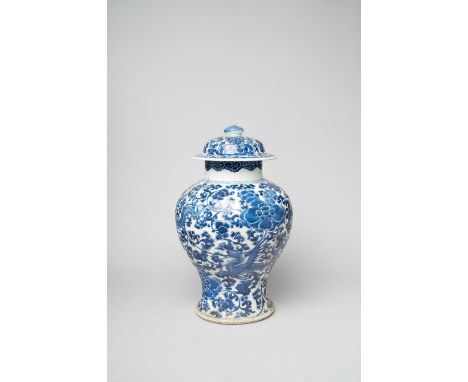 A CHINESE BLUE AND WHITE BALUSTER VASE AND COVERKANGXI 1662-1722Painted with four phoenix flying amidst peony blooms and scro