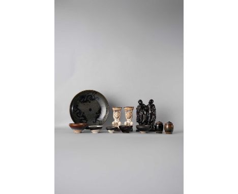 A COLLECTION OF CHINESE CERAMIC ITEMSMING DYNASTY AND LATERComprising: a treacle-glazed figural flask with a wood stand, with