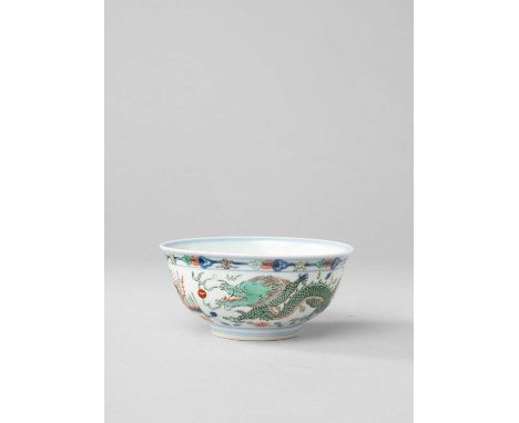 A CHINESE WUCAI 'DRAGON AND PHOENIX' BOWLPROBABLY LATE QING DYNASTYPainted to the exterior with two five-clawed dragons chasi