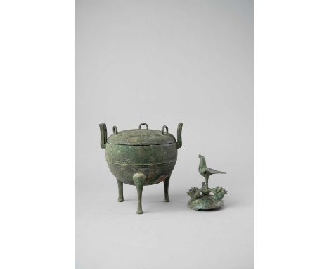 A CHINESE BRONZE TRIPOD RITUAL FOOD VESSEL AND COVER, DINGPROBABLY HAN DYNASTYThe circular body raised on three tall cabriole
