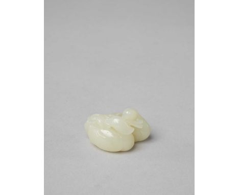 A CHINESE WHITE JADE 'MANDARIN DUCK' GROUPQING DYNASTY OR LATERThe two birds huddled together holding a single lotus flower s