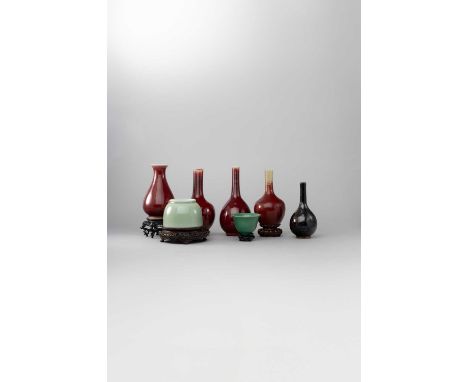 A COLLECTION OF CHINESE MONOCHROMES 18TH CENTURY AND LATERComprising: three bottle vases decorated with a deep red glaze drai