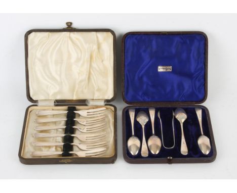 Cased set of six silver cake forks, Birmingham 1921, together with a cased set of tea spoons and sugar tongs retailed by Harr