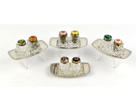 Four Norwegian silver and enamel cruet sets, 20th Century, each on silver plated stands (4)