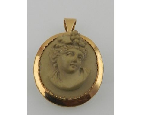 A late 19th century French yellow gold mounted relief carved Meerschaum brooch pendant, the open work mount centred with reli