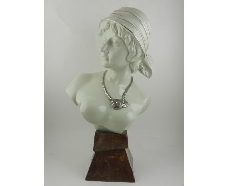 In the style of Goldscheider, an a soft paste porcelain head and shoulder bust of a female dancer, in the Art Deco style. H.5