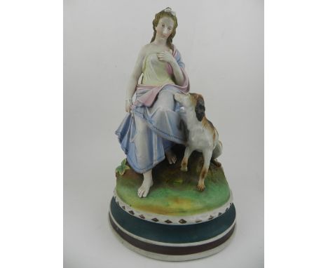 A collared bisque study of a seated lady with dog. H.31cm