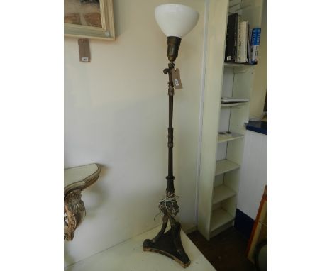 A late 19th century French carved walnut standard lamp in the Regence taste, modified. H.170cm
